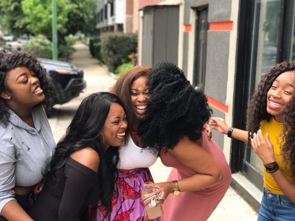 Mastering the First Impression: Your intriguing post title goes here A joyful group of friends sharing a moment of laughter on a sunny day outdoors.